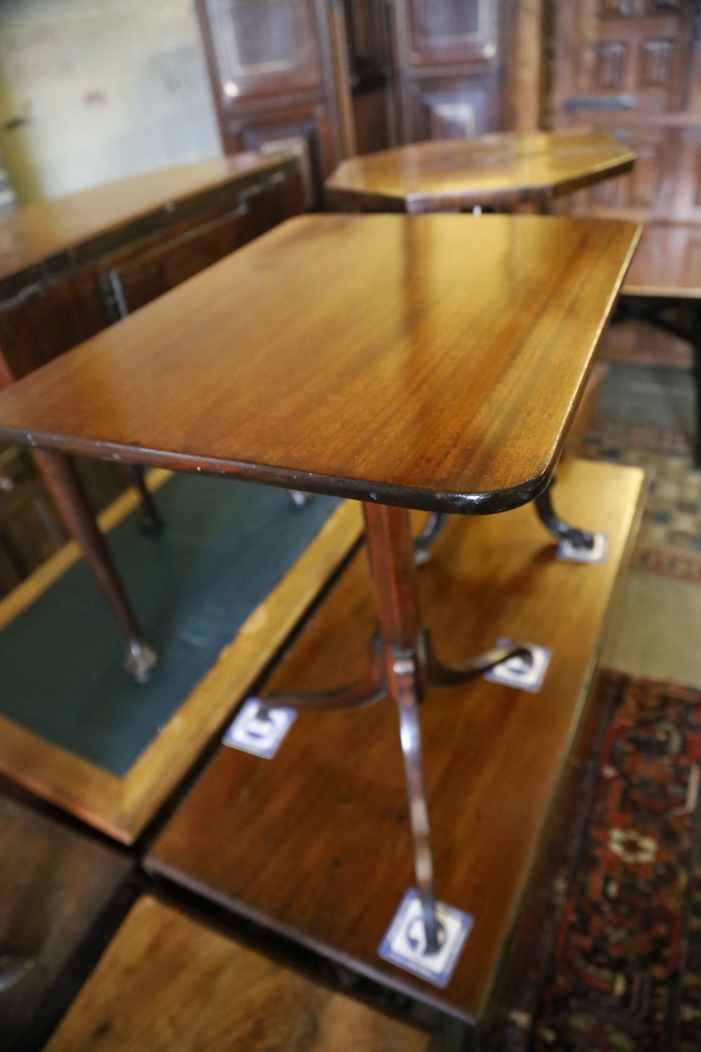 A Victorian octagonal rosewood tripod table, width 45cm, depth 74cm together with one other rectangular tripod table